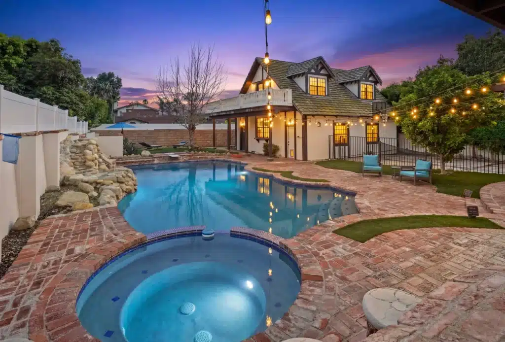 iRely Recovery Facility — Pool Sunset iRely Recovery pool at sunset with string lights and outdoor seating
